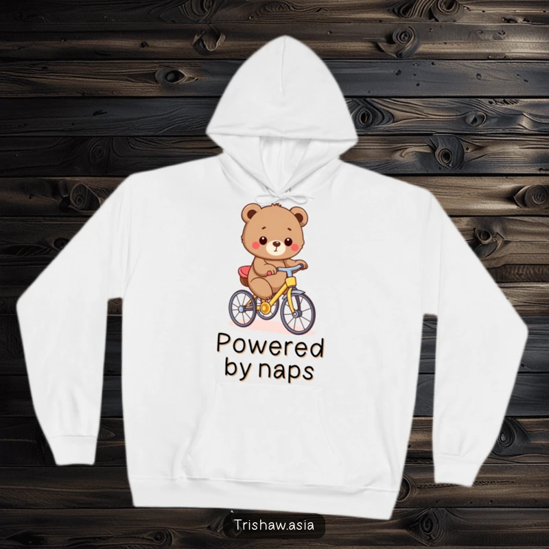 Funny Hoodie showcasing a small, round bear cub proudly pedaling a tiny, colorful trishaw, radiating warmth and humor.
